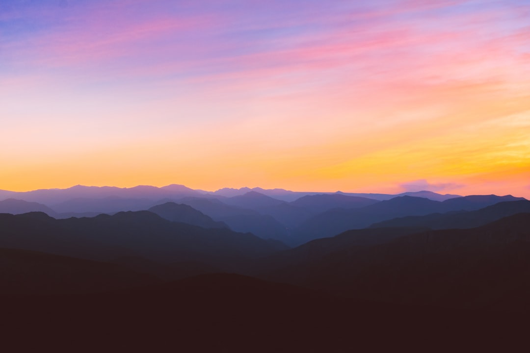 Photo by Mohammad Alizade silhouette photo of mountain during golden hour
